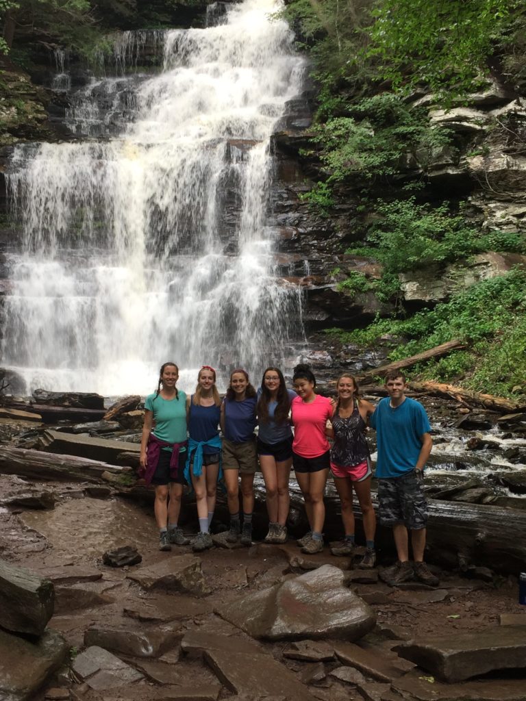 Group photo of teens and leaders in front of the Ganoga Falls